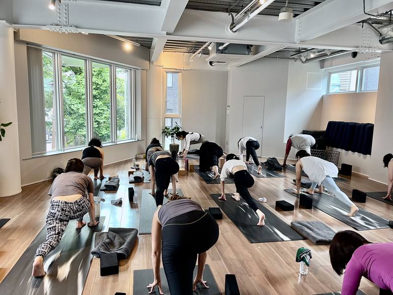 A small-group class in progress, with hands-on guidance from the teacher